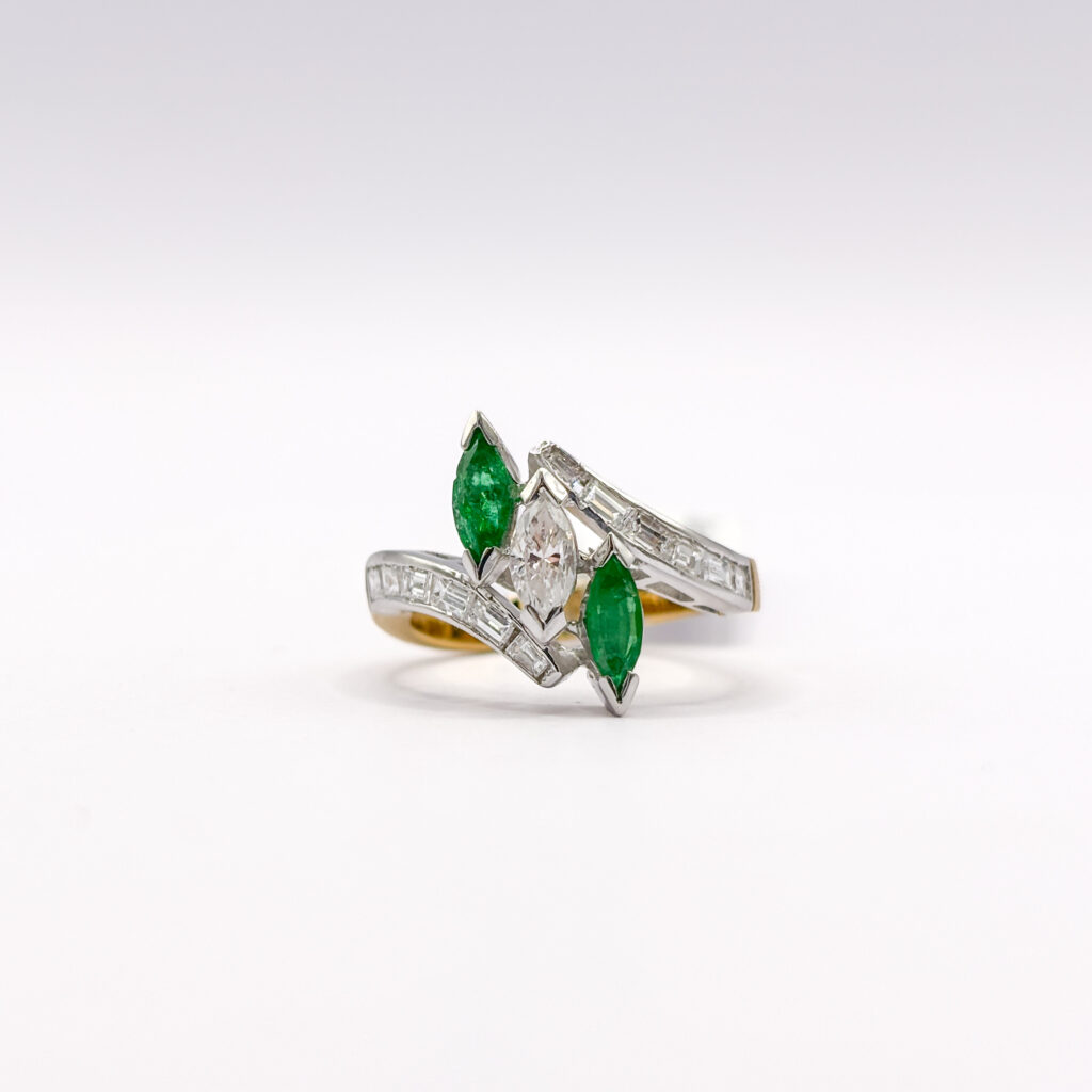 Contrarié Yellow and White Gold 18 kt Ring with Emeralds and Diamonds